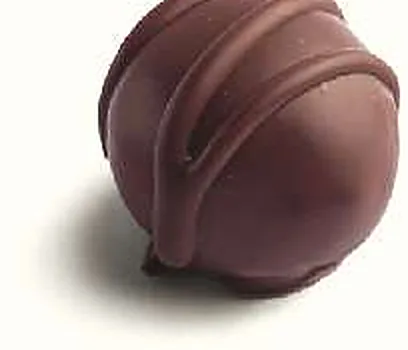Figue Huile d'Olive : figue séchée fourrée, praliné huile d'olive, enrobée de chocolat