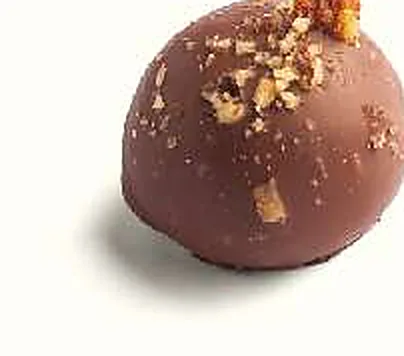 Figue Nougatine d'Amande : figue séchée fourrée, praliné amande, enrobée de chocolat